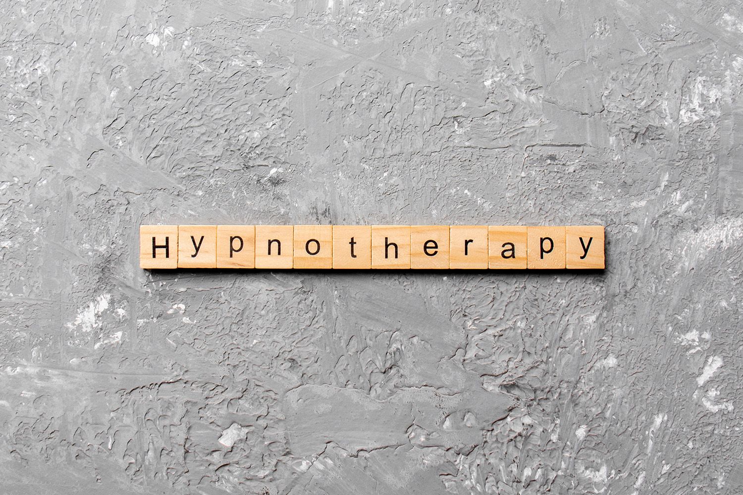Wooden blocks spelling HYPNOTHERAPY
