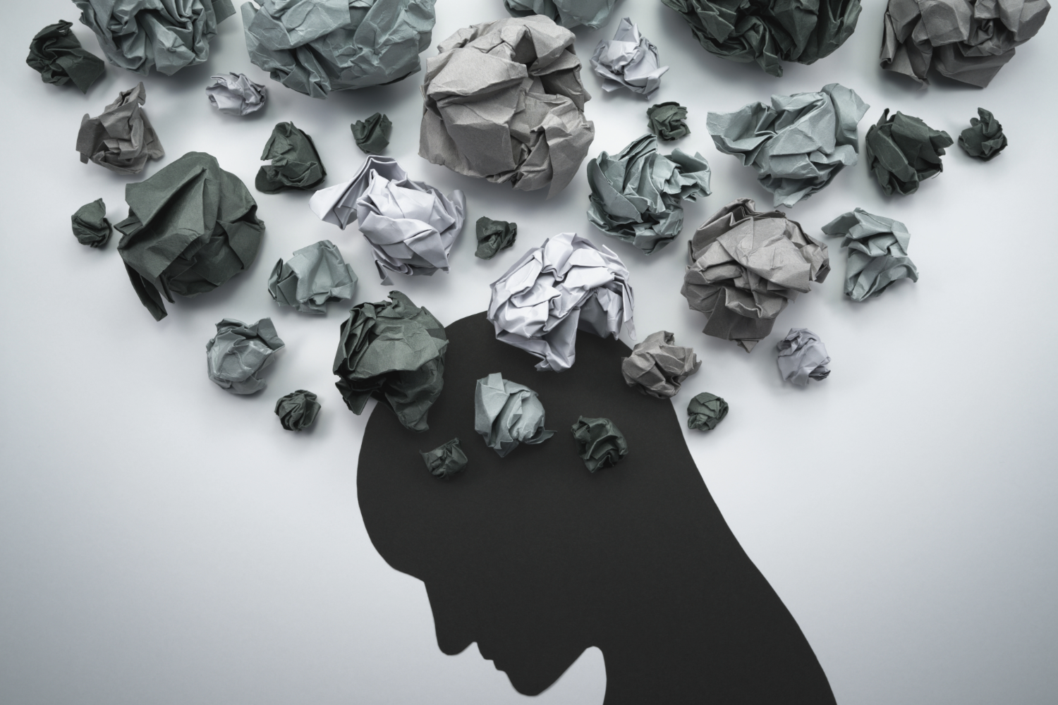 Silhouette of a head with crumpled paper